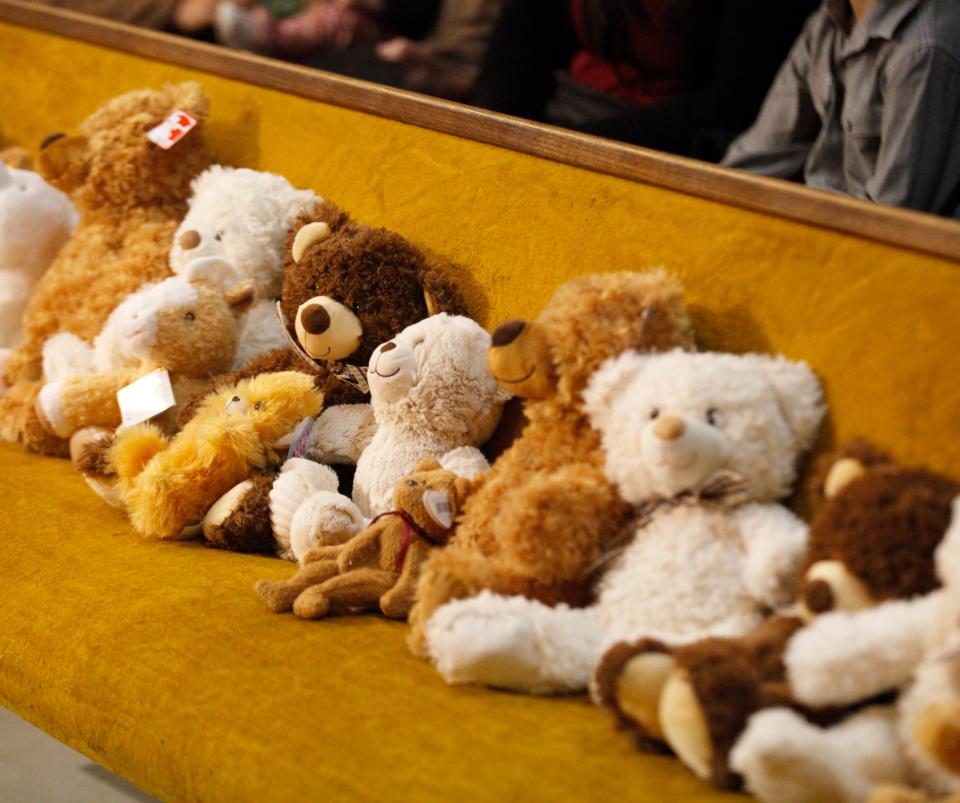 Stuffed animals up fill a bench on Nov. 18 at Lubbock Impact for children to "adopt" after their own adoptions are finalized.