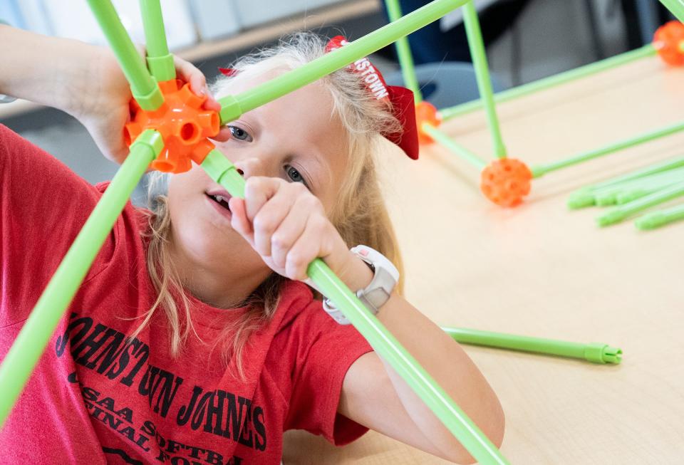 Ava Arbogast, 7, plays with the new STEAM inspired learning tools at Johnstown Elementary School on Tuesday. The district will be rolling out a new collaboration with Meta New Albany Data Center to fund enhanced K-12 Science, Technology, Engineering, Arts, and Mathematics (STEAM) education within the district.