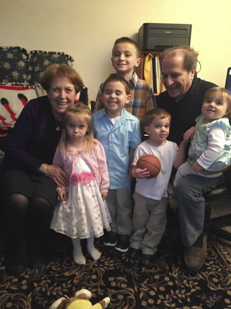 In this undated photo provided by the Middlesex District Attorney's Office, Jill D'Amore, left, and Bruno D'Amore, right, pose with children. The D'Amores, who were celebrating their 50th wedding anniversary this past weekend, and Jill D'Amore's 97-year-old mother, were found dead in their home in Newton, Mass., on Sunday, June 25, 2023, in an apparent random killing. (Middlesex District Attorney's Office via AP)
