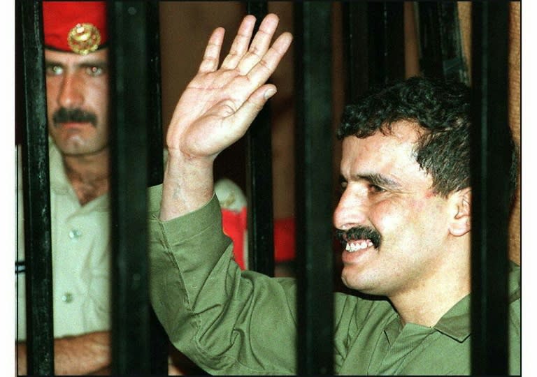 Jordanian soldier Ahmad Dakamseh waves to relatives in court on June 25, 1997 before being sentenced to 20 years for killing seven Israeli schoolgirls earlier the same year