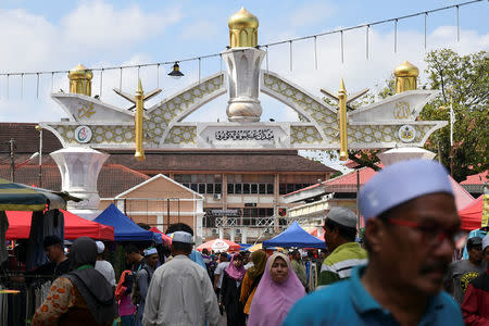 People buy groceries at Medan Ilmu after attending a 'ceramah' or religious lecture at Kota Bharu in Kelantan, Malaysia April 13, 2018. REUTERS/Stringer