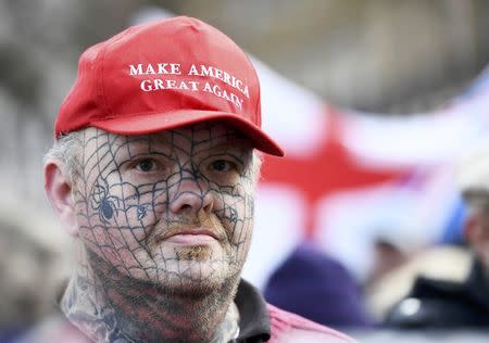 A supporter of Israel's Prime Minister Benjamin Netanyahu wears a Donald Trump campaign hat during a demonstration opposite Downing Street ahead of Netanyahu's visit, in London, Britain, Fberuary 6, 2017. REUTERS/Dylan Martinez