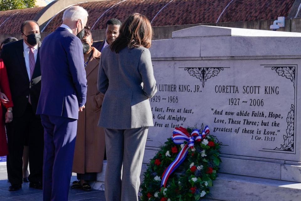 President Joe Biden and Vice President Kamala Harris pause with Martin Luther King III and other members of the King family after a wreath laying at the tomb of the Rev. Martin Luther King Jr., and his wife Coretta Scott King, Tuesday, Jan. 11, 2022, in Atlanta.