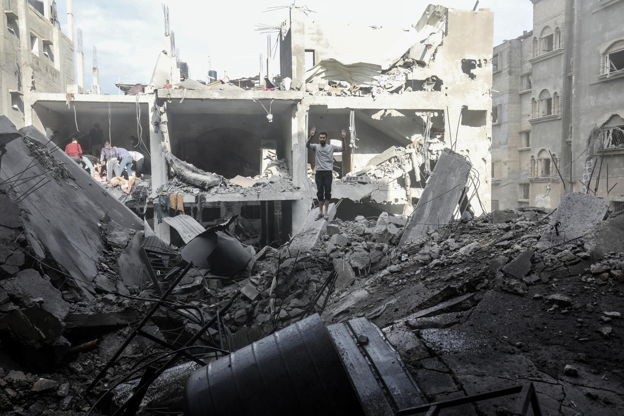 RAFAH, GAZA - OCTOBER 17: Civil defense teams and residents launch a search and rescue operation around the buildings that were destroyed after Israel's attacks on the Gaza Strip on its eleventh day in Rafah, Gaza on October 17, 2023. (Photo by Abed Rahim Khatib/Anadolu via Getty Images)