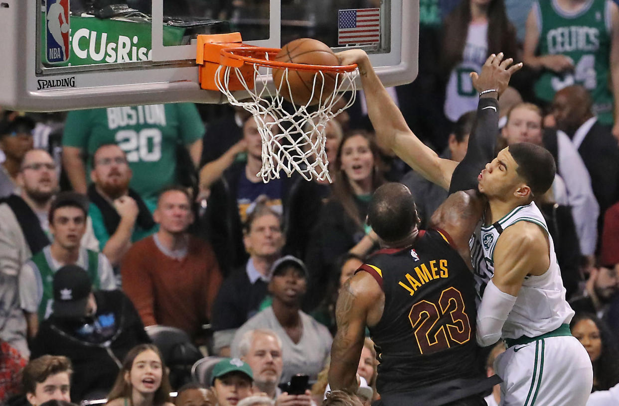 BOSTON, MA - MAY 27:  Boston Celtics Jayson Tatum scores on a slam dunks on Cleveland Cavaliers LeBron James during fourth quarter action. The Boston Celtics hosted the Cleveland Cavaliers for Game Seven of their NBA Eastern Conference Finals playoff series at TD Garden in Boston on May 27, 2018. (Photo by Matthew J. Lee/The Boston Globe via Getty Images)