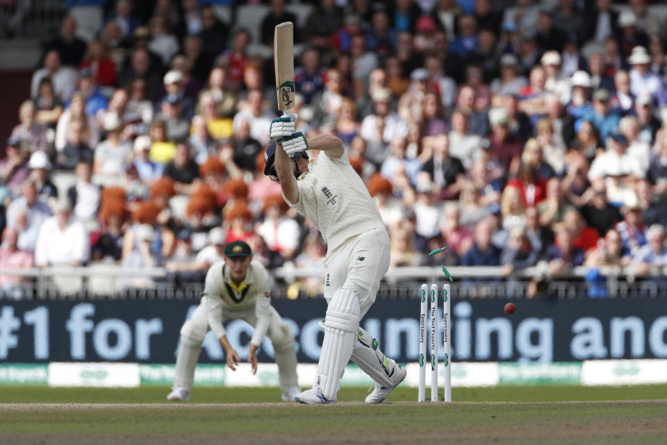 England's Jos Buttler is bowled out during day four of the fourth Ashes Test cricket match between England and Australia at Old Trafford in Manchester, England, Saturday, Sept. 7, 2019. (AP Photo/Rui Vieira)