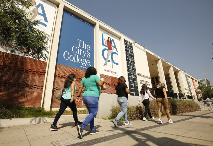 LOS ANGELES, CA - AUGUST 30: Adult students in the English as a second language class make their way on The Los Angeles Community College campus as a portion of the enrolled student body returns to in-class instruction for the reopening on Monday August 30th of Los Angeles City College (LACC) in the LACCD, the nation's largest community college district. School will look a bit different this year, as masks will be required on-campus. A majority of students at LACC are continuing with online classes for this Fall semester. LA City College on Monday, Aug. 30, 2021 in Los Angeles, CA. (Al Seib / Los Angeles Times).