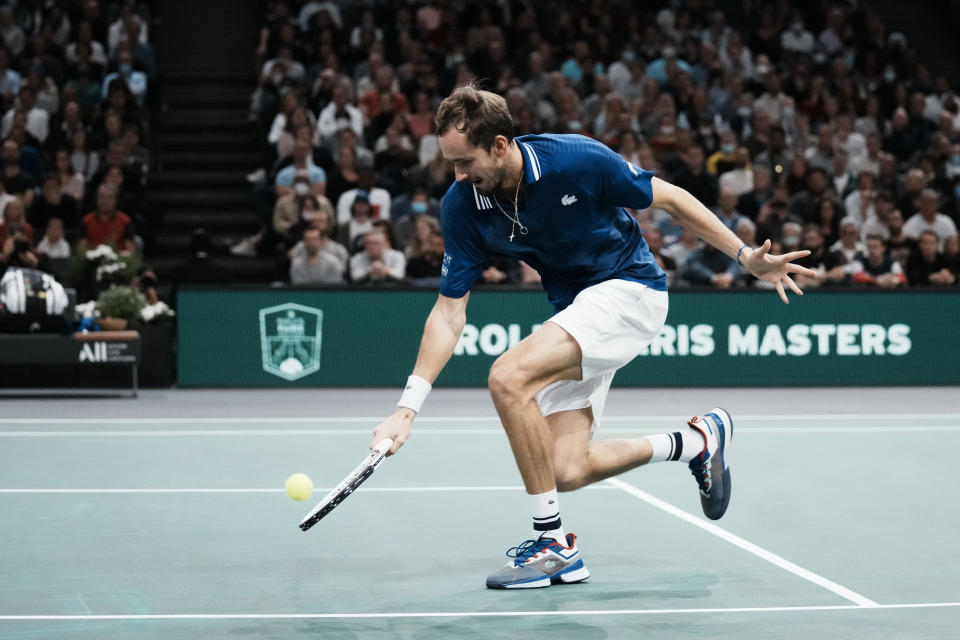 Russia's Daniil Medvedev returns the ball to Serbia's Novak Djokovic during the final match of the Paris Masters tennis tournament at the Accor Arena in Paris, Sunday, Nov.7, 2021. (AP Photo/Thibault Camus)