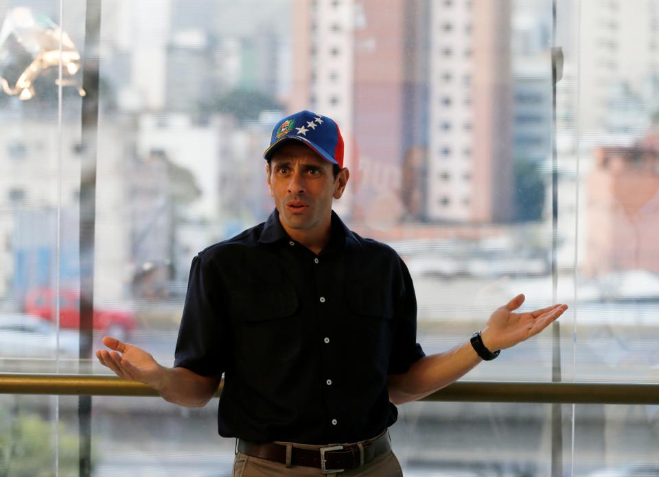 In this Feb. 25, 2014 photo, opposition leader and Miranda's State governor Henrique Capriles gestures during an interview at his office in Caracas, Venezuela. Capriles says the opposition has put its differences over strategy behind them, adding that the government may have miscalculated its response to the protests as well. (AP Photo/Fernando Llano)