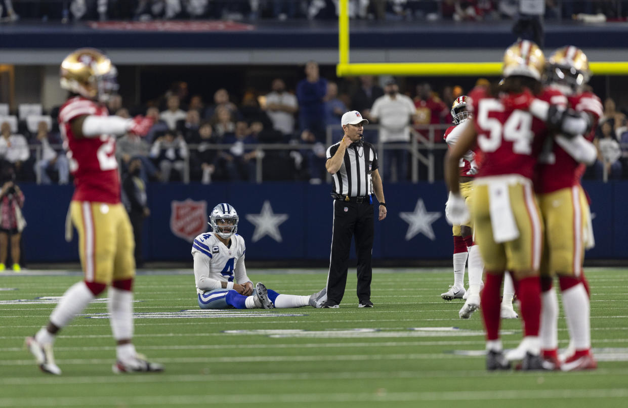 Dallas Cowboys quarterback Dak Prescott (4) looks on after throwing an incomplete pass, turning the ball over on downs to the San Francisco 49ers during a wild card NFL football game, Sunday, Jan. 16, 2022, in Arlington, Texas. San Francisco won 23-17. (AP Photo/Brandon Wade)