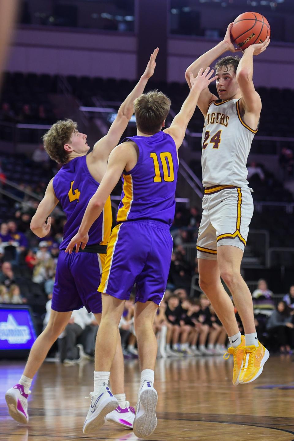 Harrisburg's guard Jacoby Mehrman (24) shoots the ball on Thursday, March 14, 2024 at Denny Sanford Premier Center in Sioux Falls.