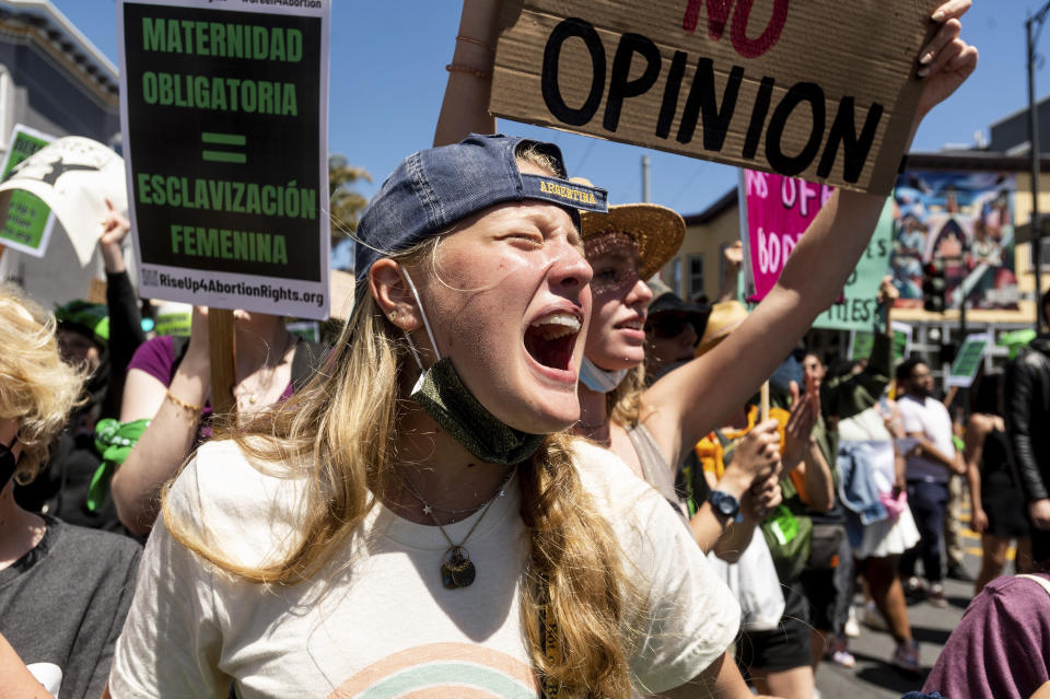 FILE - An abortion-rights supporter, who declined to give her name, chants while marching through San Francisco's Mission District on Saturday, May 14, 2022. One year ago, the U.S. Supreme Court rescinded a five-decade-old right to abortion, prompting a seismic shift in debates about politics, values, freedom and fairness. (AP Photo/Noah Berger, File)