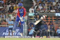 Delhi Capitals' captain Rishabh Pant, left, jumps up as Gujarat Titans' Mohit Sharma bats during the Indian Premier League cricket match between Delhi Capitals and Gujarat Titans in Ahmedabad, India, Wednesday, April 17, 2024. (AP Photo/Pravin Indrekar)