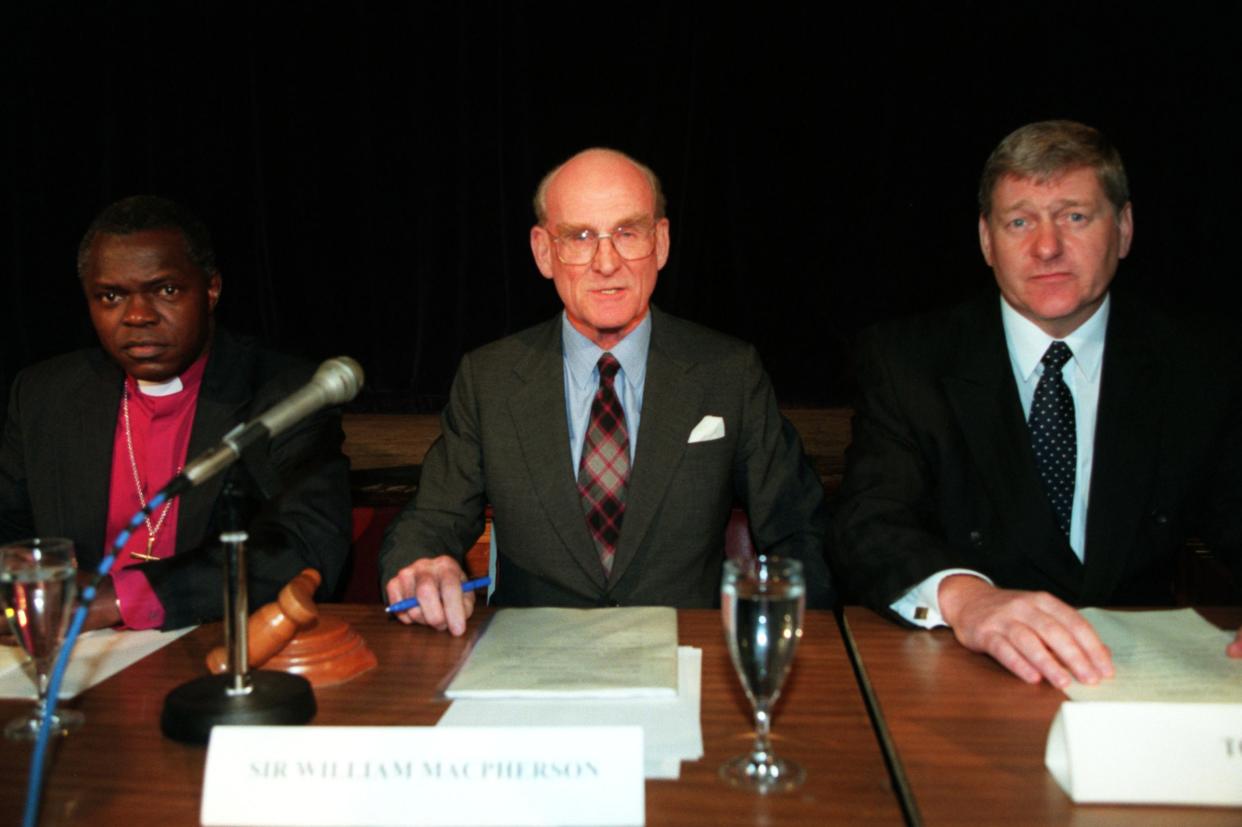Macpherson (centre) at a preliminary hearing for the inquiry (Shutterstock)