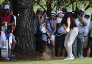 Rory McIlroy hits from rough on the fifth fairway during the first round of the Tour Championship golf tournament Thursday, Sept. 20, 2018, in Atlanta. (AP Photo/John Amis)