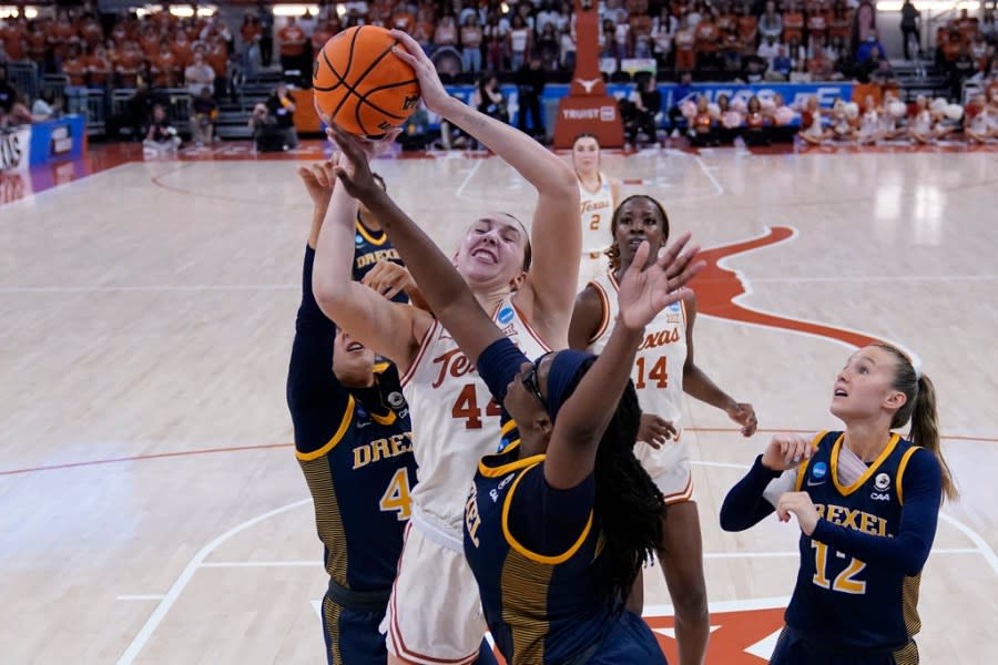 Texas forward Taylor Jones (44) grabs a rebound between Drexel forward Jasmine Valentine, front, and guard Laine McGurk, left, during the first half of a first-round college basketball game in the women’s NCAA Tournament in Austin, Texas, Friday, March 22, 2024. (AP Photo/Eric Gay)