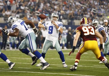 Oct 27, 2014; Arlington, TX, USA; Dallas Cowboys quarterback Tony Romo (9) throws in the pocket for a second quarter touchdown against the Washington Redskins at AT&T Stadium. Mandatory Credit: Matthew Emmons-USA TODAY Sports