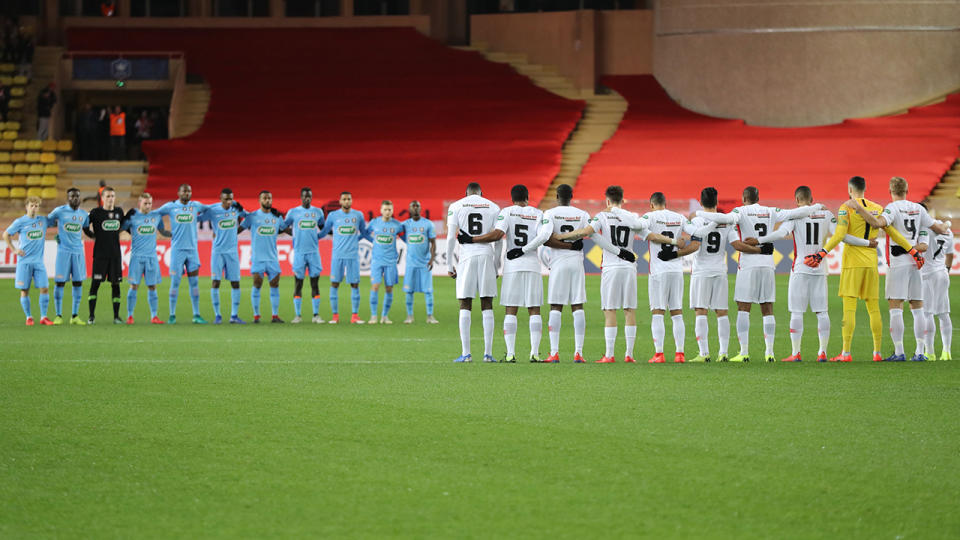 Players pay tribute to Emiliano Sala. (Photo by VALERY HACHE/AFP/Getty Images)