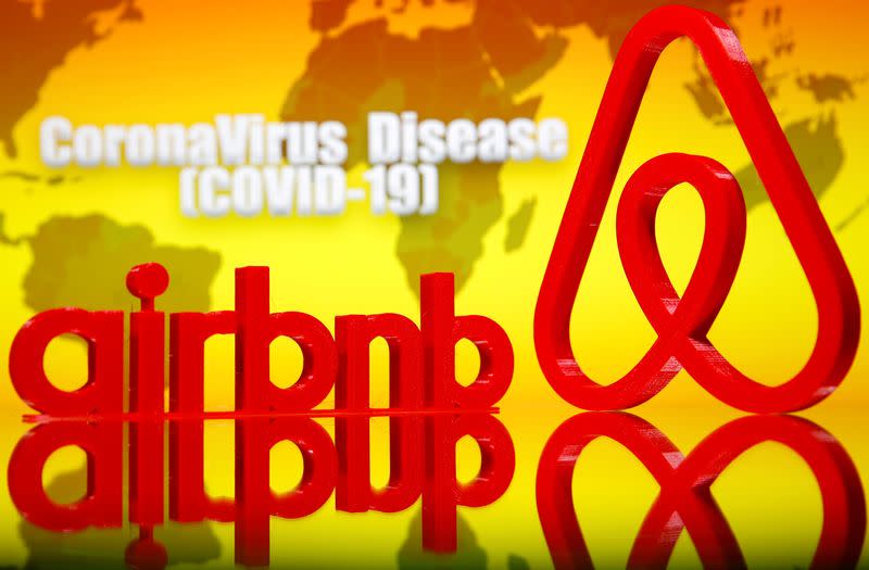 FILE PHOTO: A 3D printed Airbnb logo is seen in front of displayed coronavirus disease (COVID-19) writing in this illustration