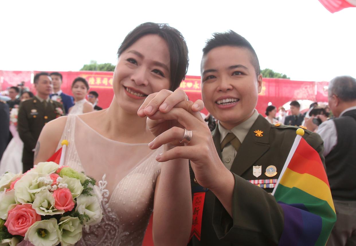 <p>The mass wedding with 188 couples at the military base where two same-sex couples married was a first</p> (Copyright 2020 The Associated Press. All rights reserved.)