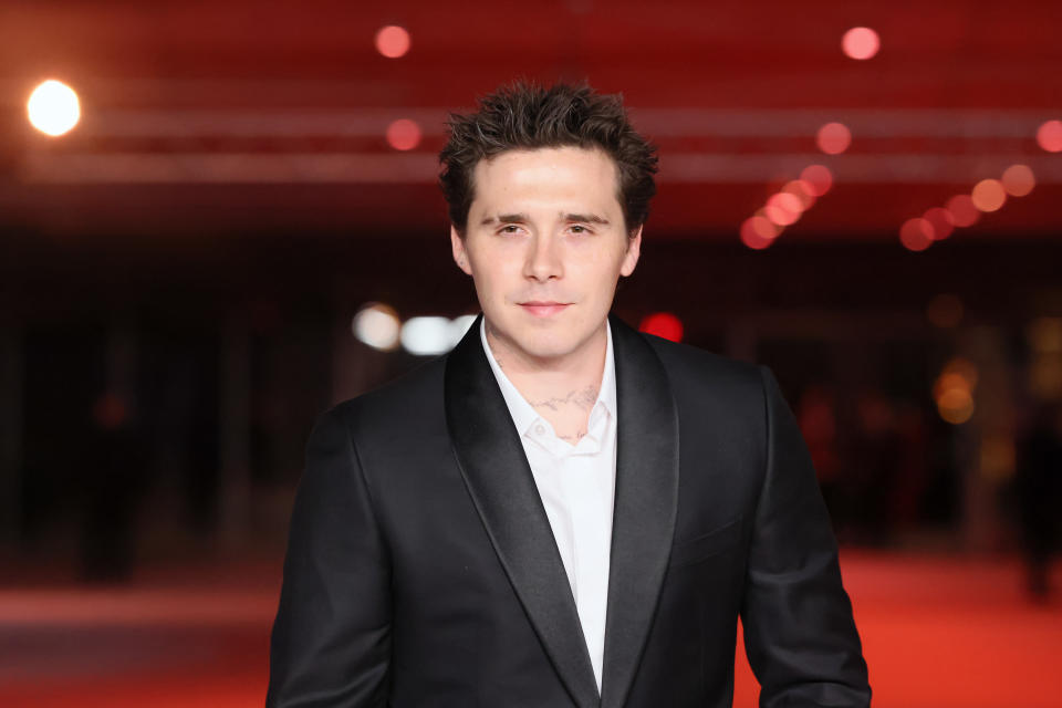 Brooklyn Beckham wears a suit at red carpet event