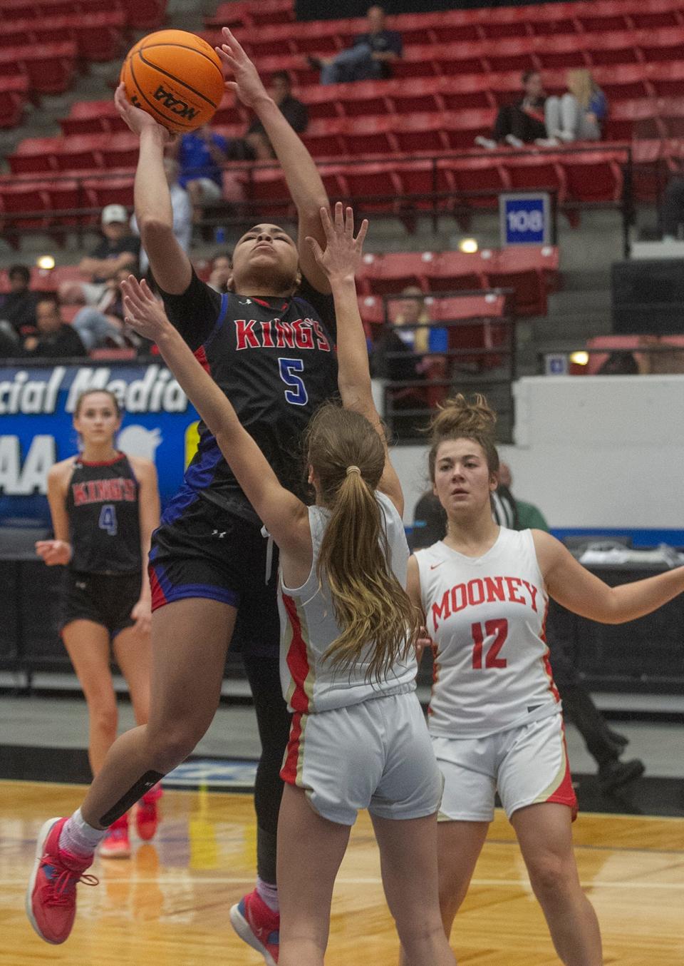 King's Academy's Janessa Williams (5) goes up for a basket against Cardinal Mooney High School during their FHSAA Girls 3A girls semifinal basketball game at The RP Funding Center in Lakeland Wednesday. February 22, 2023. (SPECIAL TO THE PALM BEACH POST/MICHAEL WILSON)