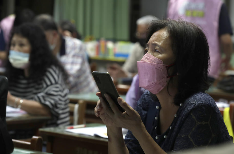 Students with Fake News Cleaner attend a class to learn how to use the LINE app in order to identify fake news, in Kaohsiung City, southern Taiwan, Thursday, March 16, 2023. An anti-misinformation group in Taiwan called Fake News Cleaner has hosted more than 500 events, connecting with college students, elementary-school children — and the seniors that, some say, are the most vulnerable to such efforts. (AP Photo/Chiang Ying-ying)