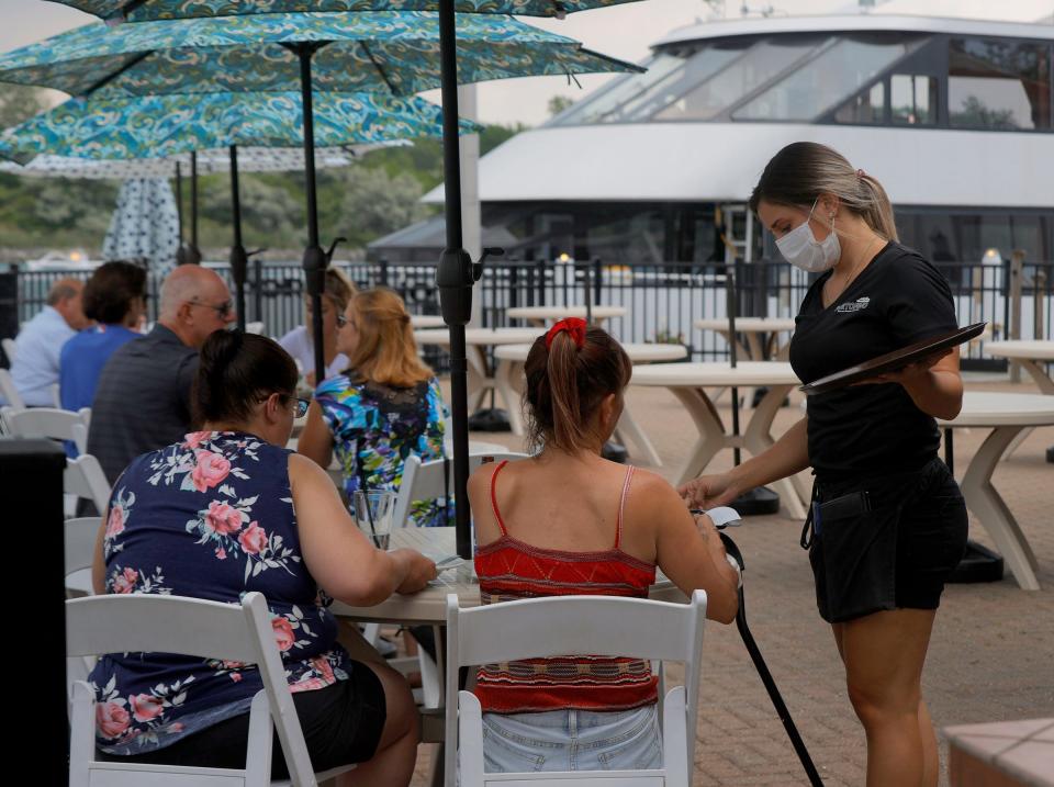 Portofino in Wyandotte has a large deck area right off of the Detroit River as people enjoy the space eating on Wednesday afternoon, June 9, 2021.