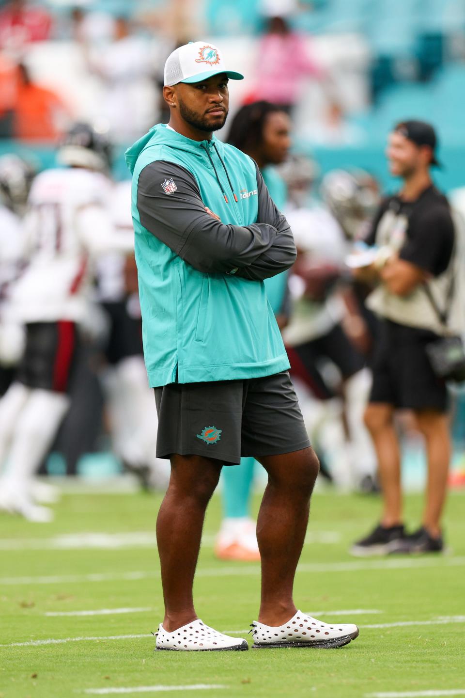 Aug 9, 2024; Miami Gardens, Florida, USA; Miami Dolphins quarterback Tua Tagovailoa looks on during warm ups before a preseason game against the Atlanta Falcons at Hard Rock Stadium. Mandatory Credit: Nathan Ray Seebeck-USA TODAY Sports