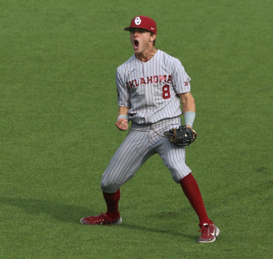 OU's John Spikerman celebrates after catching a fly ball in right field for the final out Friday.