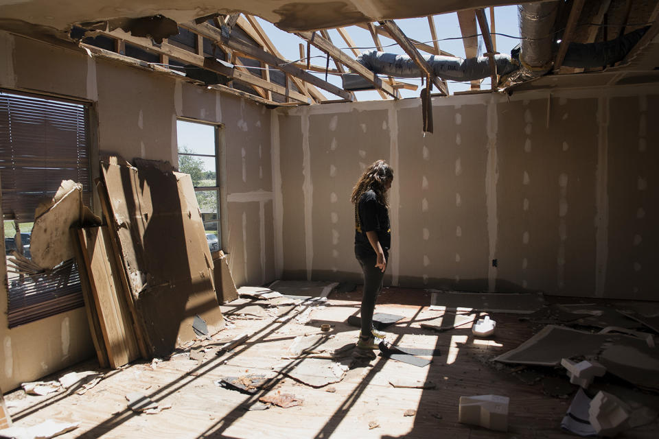 Woman looking at storm damage