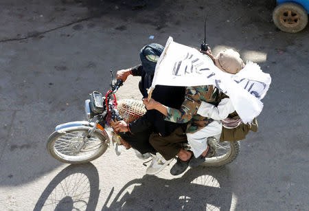 Taliban ride on a motorbike in Kabul, Afghanistan June 16, 2018. REUTERS/Mohammad Ismail