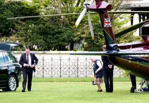 The Queen arrives at Kensington Palace by helicopter to meet Prince Louis for the first time on April 30, 2018.