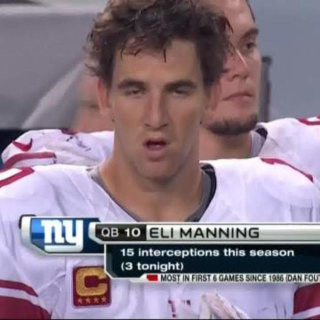 16 August 2010: New York Giants quarterback Eli Manning (10) gets tackled  and looses his helmet during first half of action of the New York Giants at  the New York Jets preseason