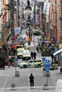 Emergency services and police work at the scene where a truck crashed into the Ahlens department store at Drottninggatan in central Stockholm, April 7, 2017