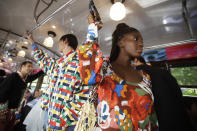 Models wear creations onboard a tram as part of the Missoni Spring-Summer 2020 collection, unveiled during the fashion week, in Milan, Italy, Thursday, Sept. 19, 2019. (AP Photo/Luca Bruno)