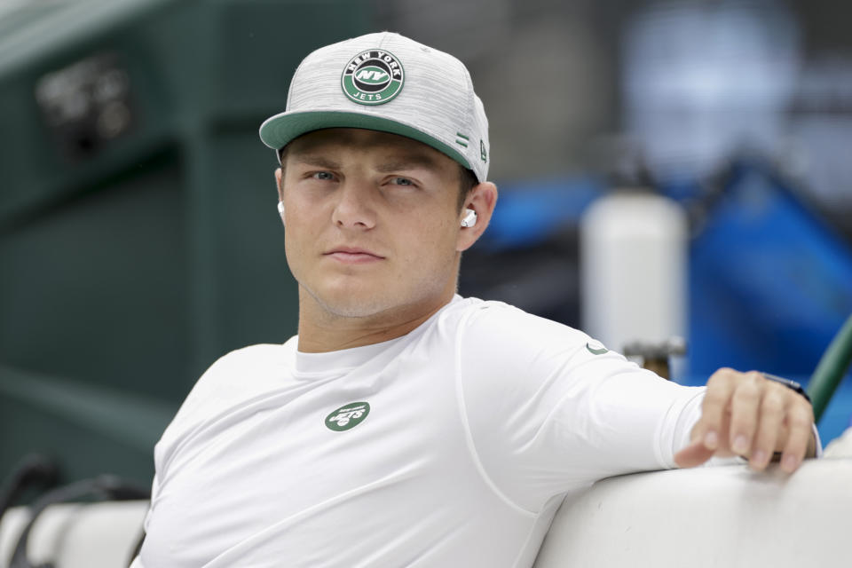 New York Jets quarterback Zach Wilson sits on the bench during practice before a preseason NFL football game against the New York Giants, Sunday, Aug. 28, 2022, in East Rutherford, N.J. (AP Photo/Adam Hunger)