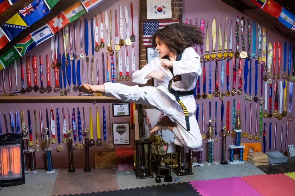 Joshua Aguirre, 11, practices his martial arts at his Lebanon home. Joshua's parents turned their attic space into a makeshift studio so that Joshua could have a place to practice at home.