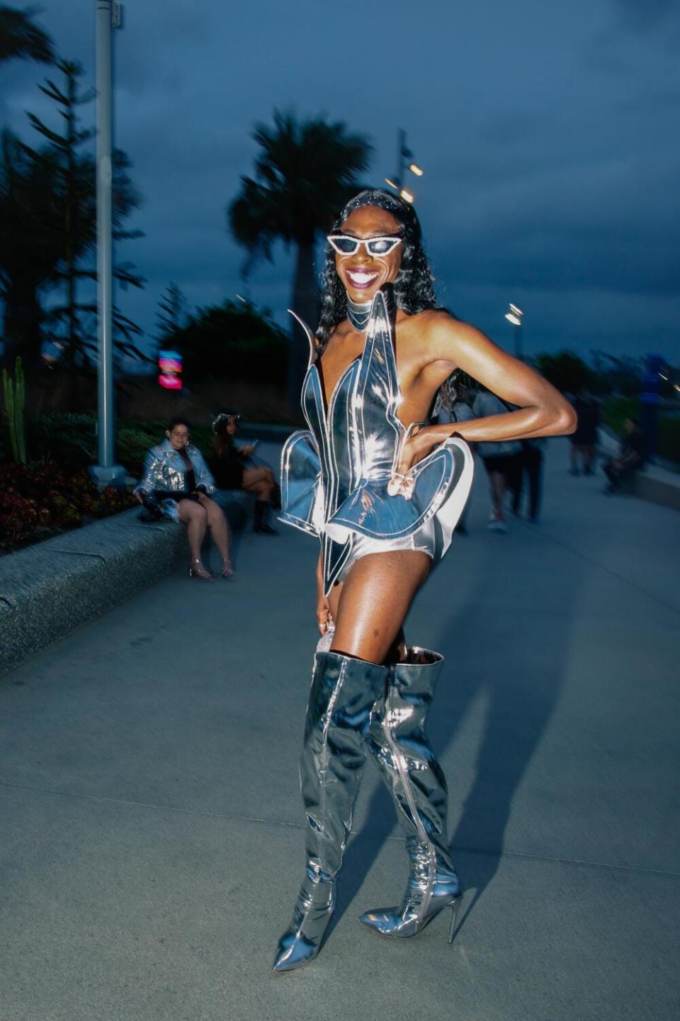 A woman poses at a concert