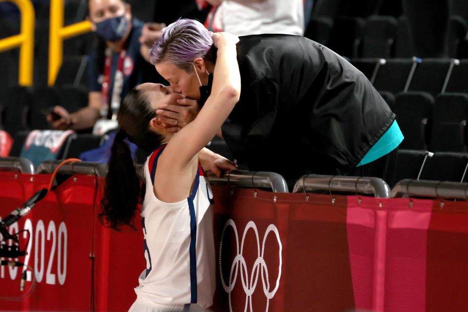 Sue Bird #6 of Team United States kisses Megan Rapinoe in celebration after the United States' win over Japan in the Women's Basketball final game on day sixteen of the 2020 Tokyo Olympic games at Saitama Super Arena on August 08, 2021. (Kevin C. Cox / Getty Images)