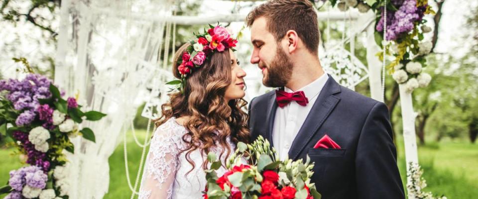 bride and groom and bride is wearing bohemian flower crown