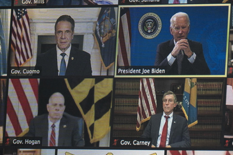 President Joe Biden is seen on a screen as he speaks during a virtual meeting of the National Governors Association, in the South Court Auditorium on the White House campus, Thursday, Feb. 25, 2021, in Washington. (AP Photo/Evan Vucci)