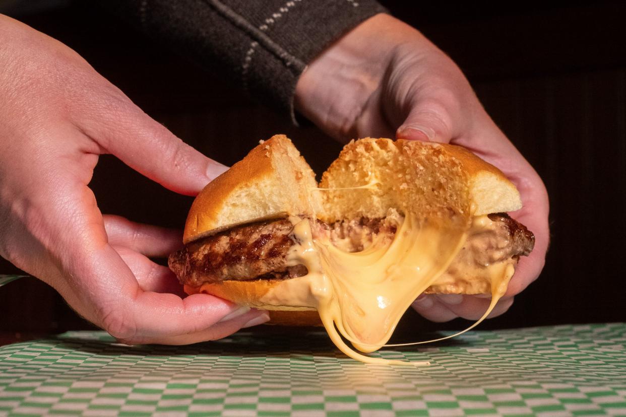 5-8 Club Juicy Lucy being pulled apart to show melting cheese