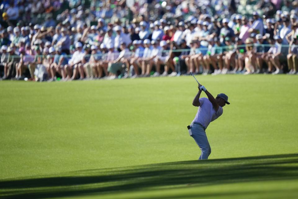 Bryson DeChambeau hits from the fairway on the 13th hole during third round at the Masters golf tournament at Augusta National Golf Club Saturday, April 13, 2024, in Augusta, Ga. (AP Photo/Matt Slocum)