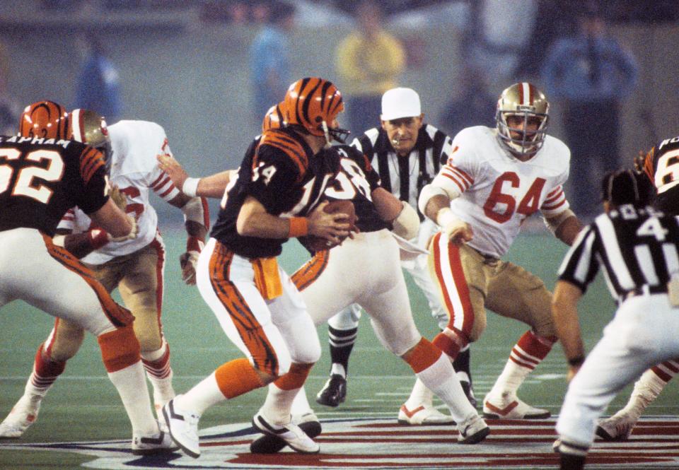 Jan 24, 1982; Detroit, MI, USA; San Francisco 49ers linebacker Jack Reynolds (64) watches Cincinnati Bengals quarterback Ken Anderson (14) during Super Bowl XVI at the Silverdome. The 49ers defeated the Bengals 26-21. Mandatory Credit: Richard Mackson-USA TODAY Sports