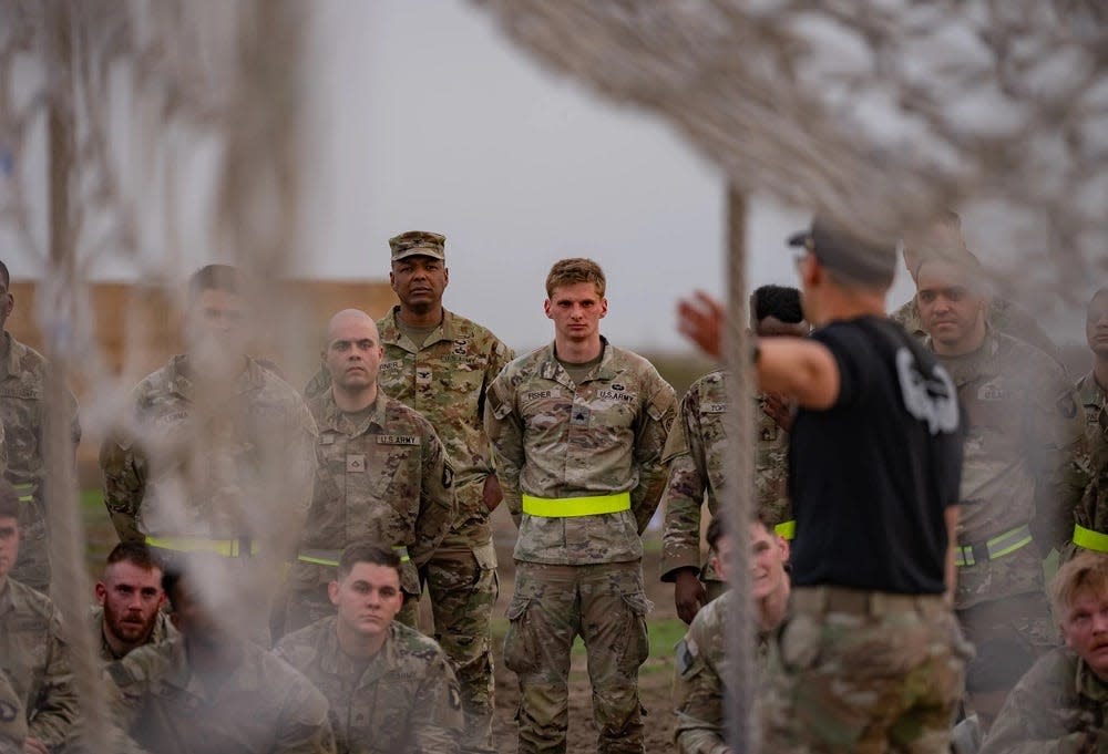Sgt. Joseph Fisher, a paratrooper assigned to Headquarters and Headquarters Battalion, 82nd Airborne Division, "Task Force 82", receives instructions for how to navigate an obstacle course April 2, 2024, at Mihail Kogalniceanu Air Base, Romania.