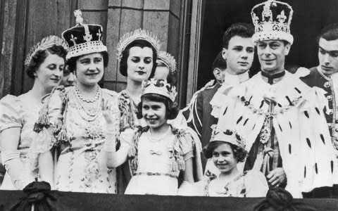 The nine year old Princess Elizabeth waves at the coronation of her father King George VI - Credit: Keystone/Getty Images