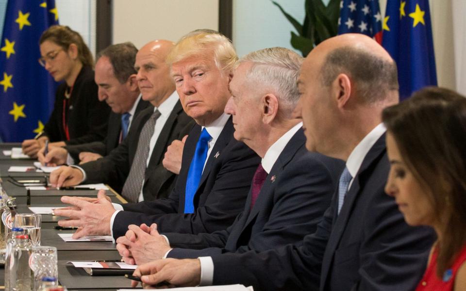 US President Donald Trump and US defence minister, James Mattis (Third right) meets with officials during a meeting at the European Union Headquarters during a NATO meeting in Brussels - Credit: STEPHANIE LECOCQ/AFP