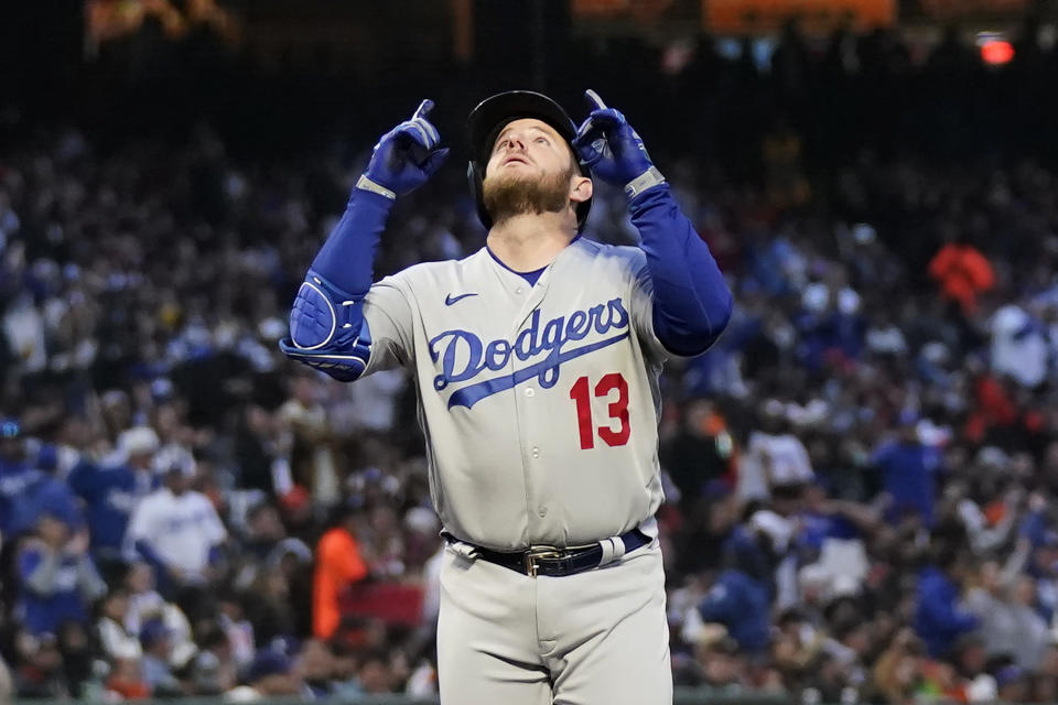 Los Angeles Dodgers' Max Muncy gestures after hitting a three-run home run against the San Francisco Giants during the third inning of a baseball game in San Francisco, Monday, April 10, 2023. (AP Photo/Jeff Chiu)