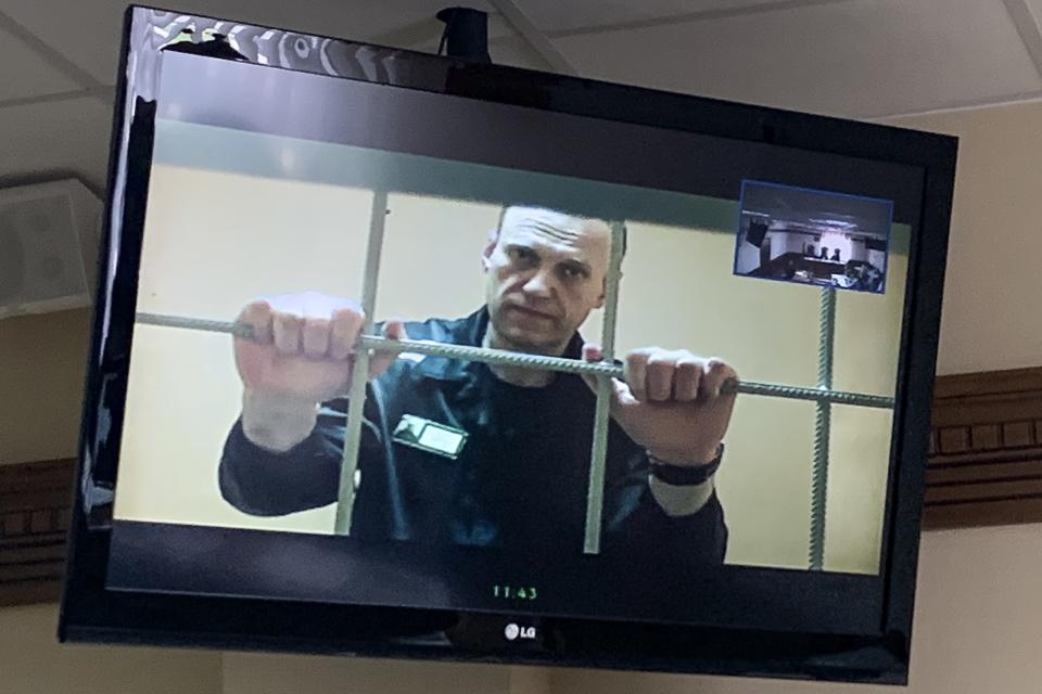 Russian opposition leader Alexei Navalny appears from prison on a video link provided by the Russian Federal Penitentiary Service, at a courtroom in Vladimir, Russia, Tuesday, June 7, 2022. A court in Vladimir region on Tuesday rejected an appeal of Russian opposition leader Alexei Navalny against the correctional colony's decision to label him 